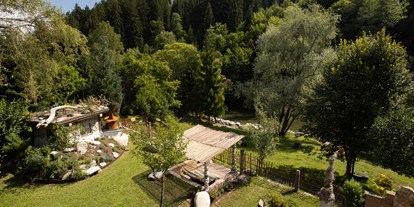Hüttendorf - Sauna: im Hauptgebäude - Hermagor - Verwunschener Garten von Smileys Fluss Chalet  - Smileys Fluss Chalet