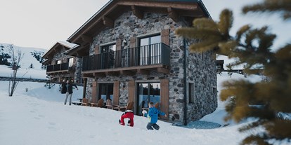 Hüttendorf - Typ: Skihütte - Österreich - Spielen im Schnee mit der ganzen Familie im großen Garten - Kauz - Design Chalets